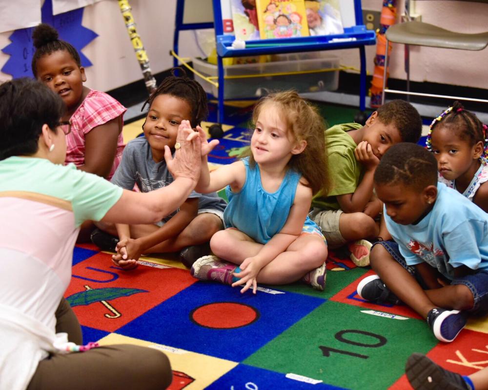 student high five teacher