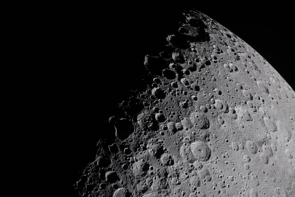 The Artemis II crew captures a portion of the Moon coming into view along the terminator – the boundary between lunar day and night – where low-angle sunlight casts long, dramatic shadows across the surface. Features include Jule Crater, Birkhoff Crater and Stebbins Crater. Photo by NASA