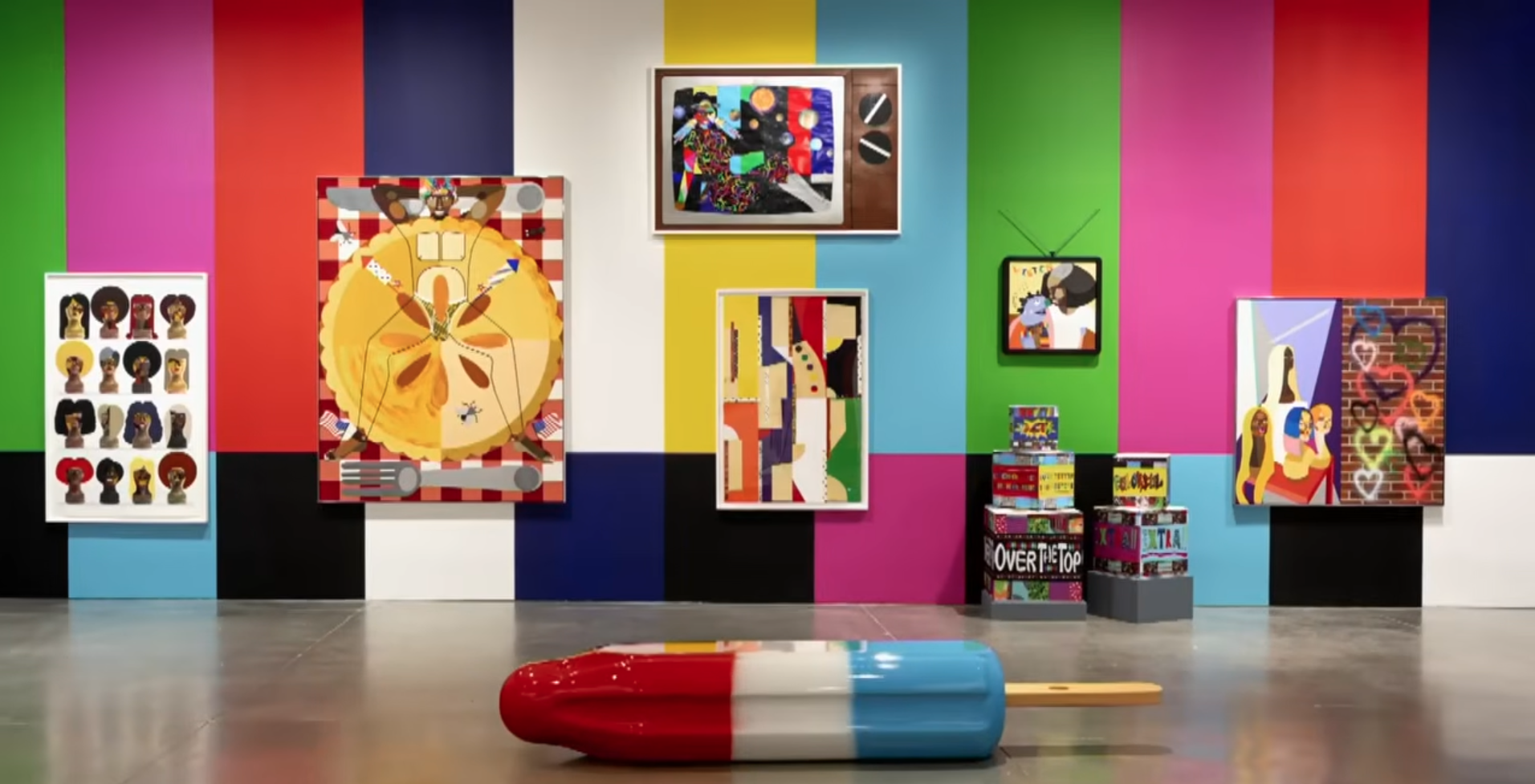 Colorful artwork by Derrick Adams is displayed in a gallery, highlighting themes of joy, community and the Black American experience.