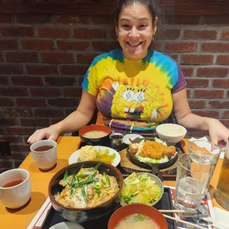 Sissy enjoying a meal after one of our half marathons, March 2024.