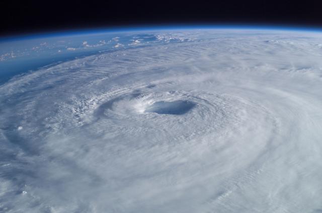 How did climate change affect Hurricanes Harvey and Irma?